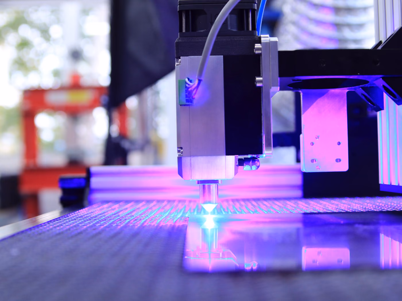 Close-up of laser engraving in progress on the Ortex Industries production floor